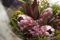 the Spring bouquet of red protea, waxflower a for a special wedding ceremony