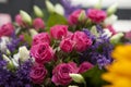 Spring bouquet of red rose, lisianthus and lilac a for a special Royalty Free Stock Photo