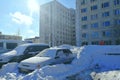 Spring, cars melted after winter in the courtyard of the house