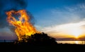 Walpurgis Night in Sweden fire shaped as a heart in the sunset Royalty Free Stock Photo