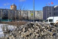 Spring in the city. Clearing the streets of ice. A pile of crushed ice lying on the road. Balashikha, Moscow region, Russia