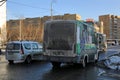 Spring is in the city. Dirty buses and cars in the street. Balashikha, Moscow oblast, Russia