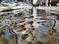 Spring, city stream in the Park on the pavement