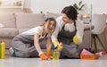 Spring-Clean. Young Couple Having Fun While Cleaning House, Washing Floor Together Royalty Free Stock Photo