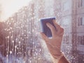 Spring cleaning - cleaning windows. Women`s hands wash the window, cleaning Royalty Free Stock Photo