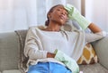 Spring cleaning, exhausted and female cleaner on a sofa taking a break while doing housework in a home. Tired, stress Royalty Free Stock Photo