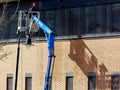 Spring Cleaning from High Boom Platform or cherry picker