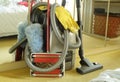 Spring-cleaning or house-cleaning concept wth vaccuum cleaner,carpet sweeper,feather duster and rubber gloves