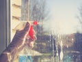 Spring cleaning - cleaning windows. Women`s hands wash the window, cleaning Royalty Free Stock Photo