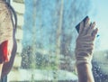 Spring cleaning - cleaning windows. Women`s hands wash the window, cleaning Royalty Free Stock Photo