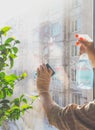 Spring cleaning - cleaning windows. Women`s hands wash the window, cleaning Royalty Free Stock Photo