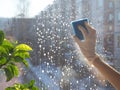 Spring cleaning - cleaning windows. Women`s hands wash the window, cleaning Royalty Free Stock Photo