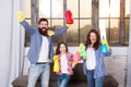 Spring cleaning. Your one stop for home cleaning needs. Happy family hold cleaning products. Mother, father and daughter