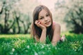 Spring closeup outdoor portrait of adorable 11 years old preteen kid girl