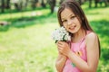 Spring closeup outdoor portrait of adorable 11 years old preteen kid girl