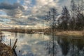 Spring cloud landscape with reflection in river water Royalty Free Stock Photo