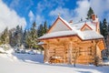 Spring comming to closed mountain hut in winter