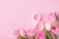 Spring composition with bouquet of pink tulip flowers and 8 number from ribbon. Greeting card for International Women Day. Royalty Free Stock Photo