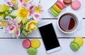 Spring composition: bright colors, multicolored macaroons and cu Royalty Free Stock Photo