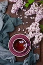 Spring composition with lilac and tea cup Royalty Free Stock Photo