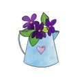 Spring composition of violet flowers, frog and bucket.