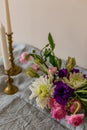 Spring concept. Flower arranagement and vintage candleholders