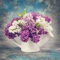 Spring concept. Lilac in pitcher Vintage retro hipster style version