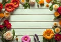 Spring concept, rustic white painted wooden table, surrounded by spring flowers, top view with copy space