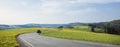 spring countryside of german sauerland with blooming fields of dandelions Royalty Free Stock Photo