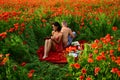 Spring couple on poppy field. Naked nature. Lovers in flowers lawn. Sensual seductive. Love story. Erotica love game.