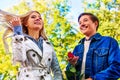 Spring couple walking park. Fall friends walk under rain umbrella. Royalty Free Stock Photo