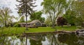 Spring day in Canton, Ohio, USA. A boat in the water, green grass and trees