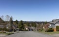 Spring day view of a residential neighborhood community in Washington State USA, with view of cascade mountains in background