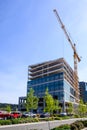 Spring District, new construction and working crane on a sunny day