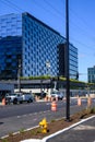 Spring District, worker in a bucket truck working on a new street light in front of new commercial buildings