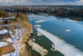 Spring early drift on beautiful river with broken off pieces of ice float down the stream