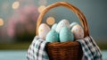 spring easter scene, a plaid cloth with a blurred pastel field is the backdrop for a wicker basket overflowing with Royalty Free Stock Photo