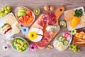 Spring or Easter charcuterie table scene against a wood background Royalty Free Stock Photo