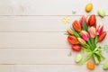 Spring easter tulips in bucket on white vintage background. Royalty Free Stock Photo