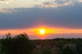 On a spring evening, the sun sets behind the mountains of Slovakia. Dramatic sunset, spring landscape. Royalty Free Stock Photo