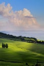 Art spring farmland and country road; tuscany countryside rolling hills Royalty Free Stock Photo