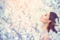 Spring fashion girl in blooming trees Royalty Free Stock Photo