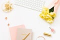 Spring Feminine workspace fashion blogger. For a blog or online store with copy space. Notebooks with a pen, a bouquet of yellow