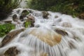 Spring floods on mountain rivers form small waterfalls Royalty Free Stock Photo