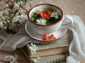 Spring floral herbal mint tea with flower buds of apple tree and quince flowers , vintage retro composition Royalty Free Stock Photo