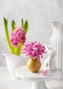 Spring floristic arrangement with pink hyacinth flowers in a small vase for Eastern.