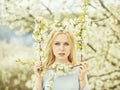 Spring flower frame in cherry garden with beautiful young girl Royalty Free Stock Photo