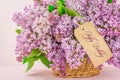 Spring Flowers Beautiful Pink  Blue Lilac Branch In Basket. Happy Birthday Text
