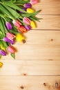 Spring Flowers bunch at wood floor texture. Beautiful Tulips bou