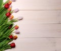 Spring flowers composition on the wooden background.Top view colorful tulips  on a wooden surface. Copy space Royalty Free Stock Photo